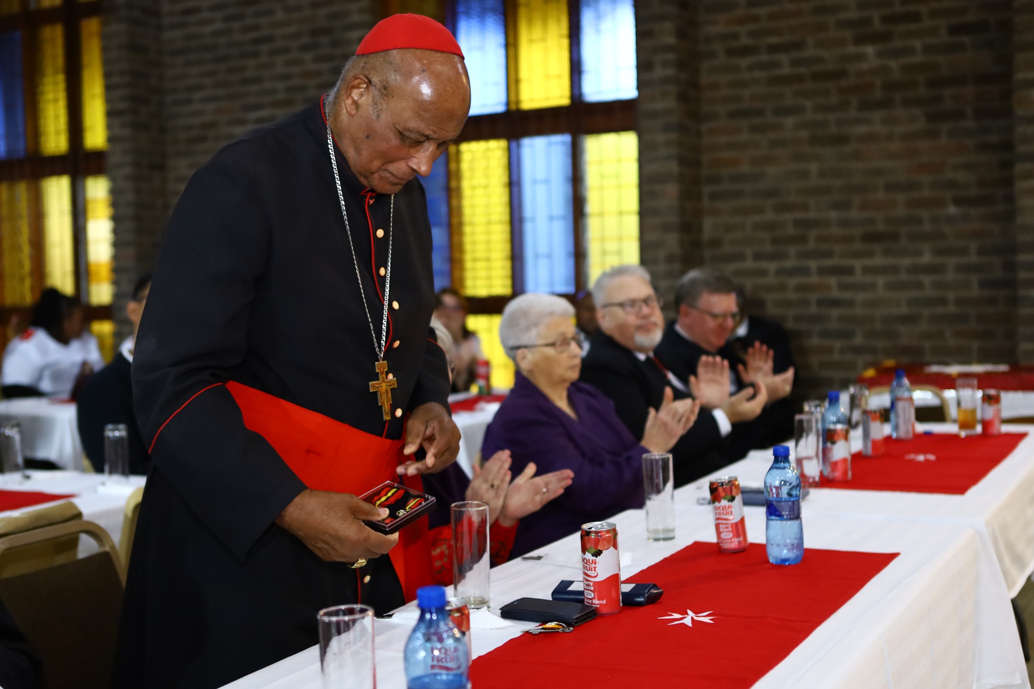 Cardinal Napier holding the Gold Medal of Merit on 6 September 2026