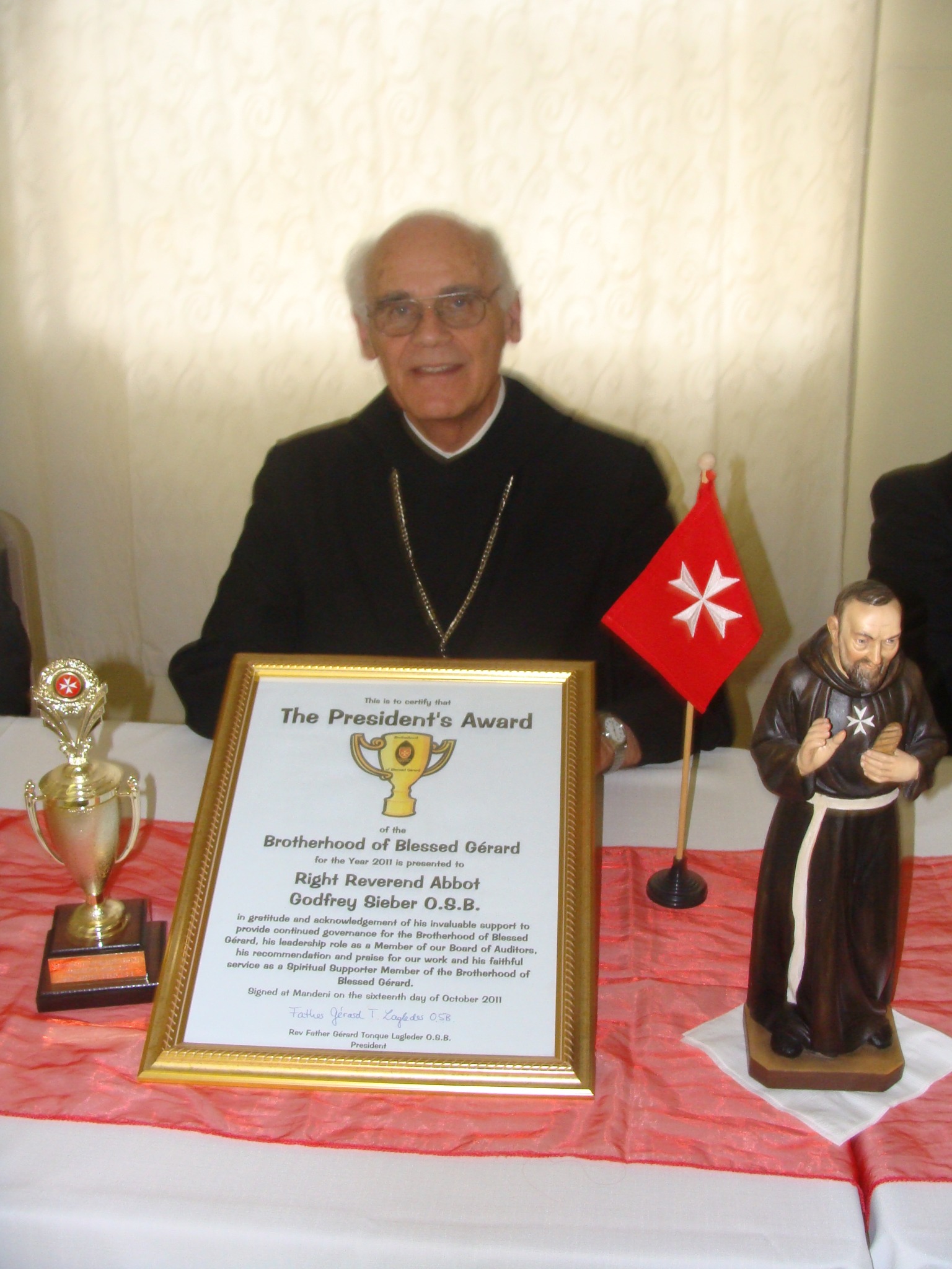 Abbot Godfrey Sieber with the President’s Award certificate and trophy in 2011