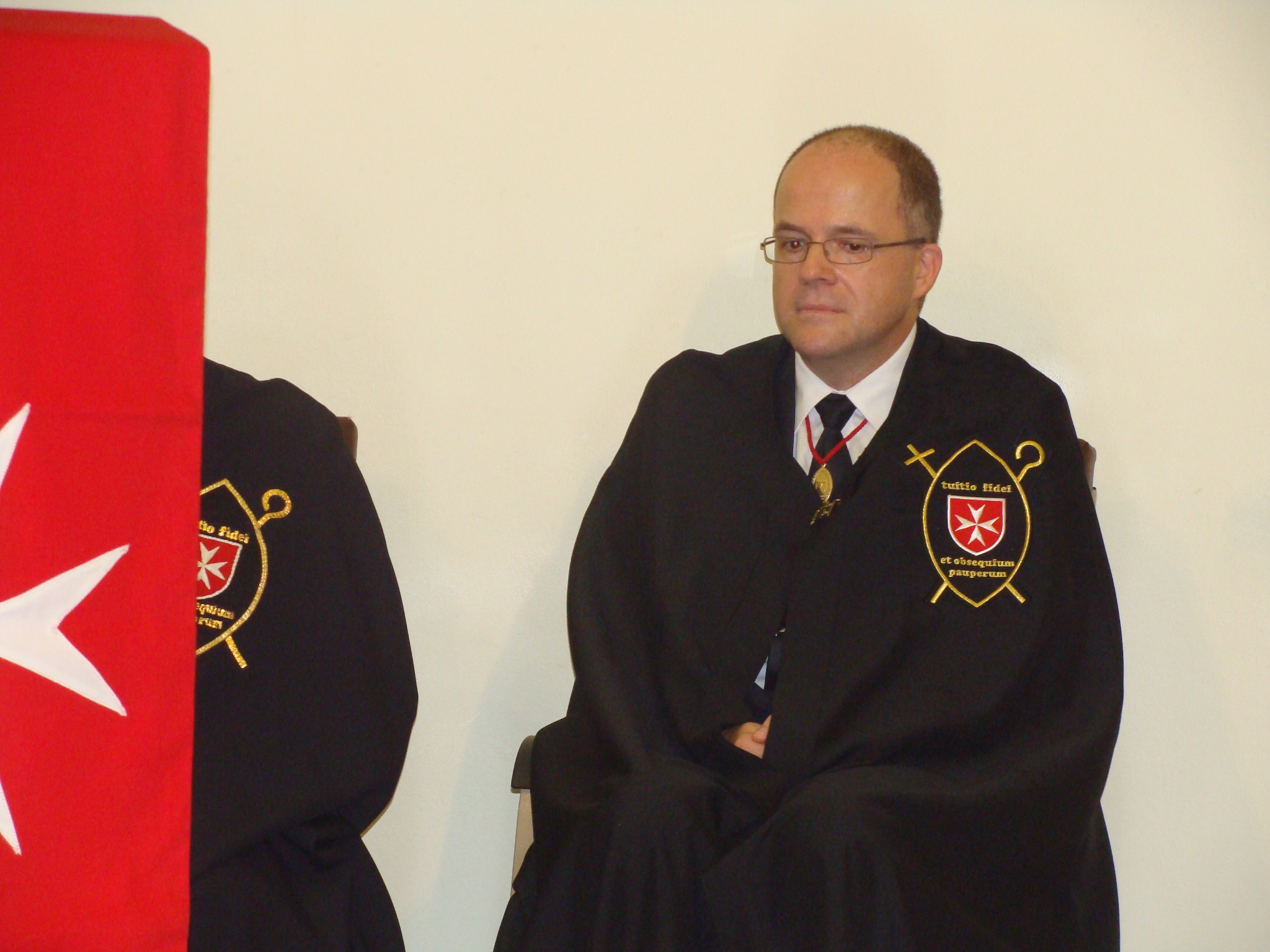Dr Andreas Heinze wearing the Brotherhood's cape and insignia