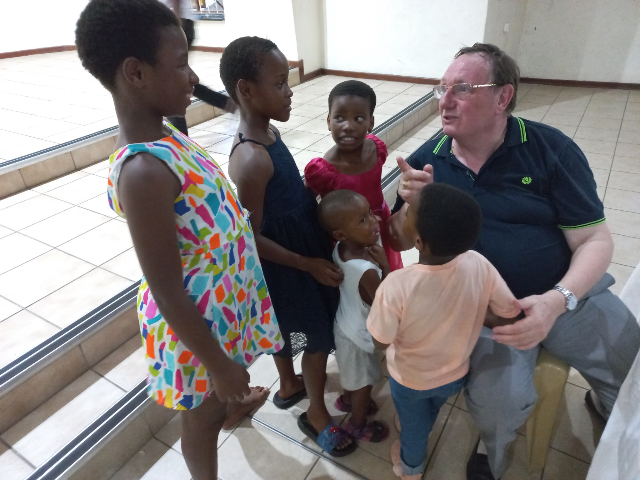 Bishop Jean Clément Laffitte speaking with children during his January 2023 visit to Mandeni