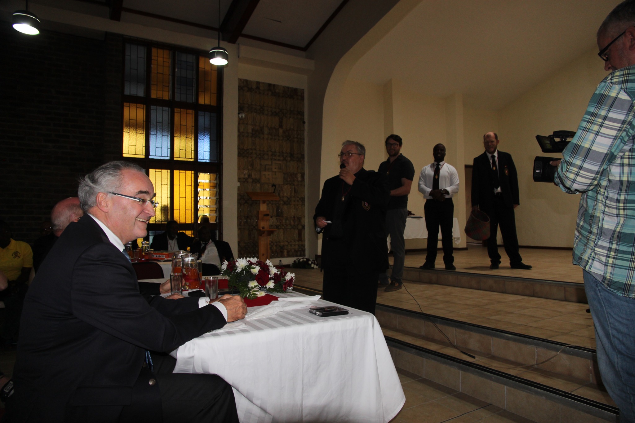 Dominique Prince de La Rochefoucauld-Montbel seated during the twenty-fifth anniversary gathering