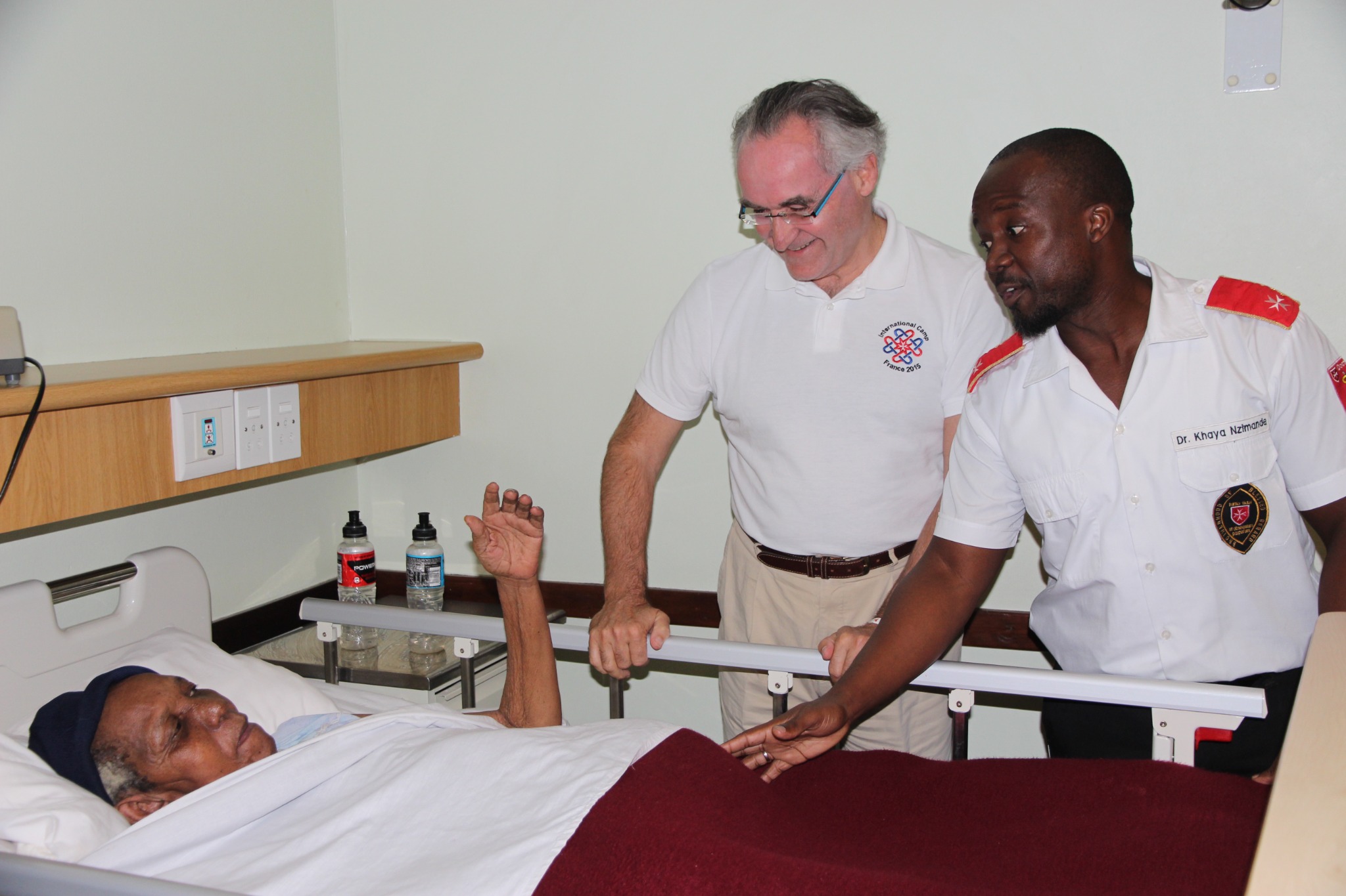 Dominique Prince de La Rochefoucauld-Montbel and Brotherhood staff with a patient in Blessed Gérard's Hospice